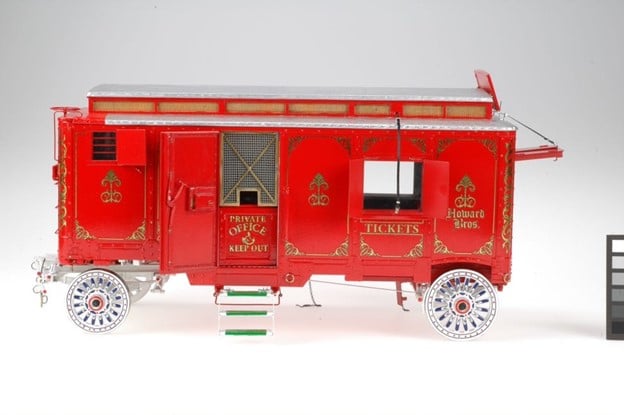 the exterior view of a model red wagon with its doors and windows open
